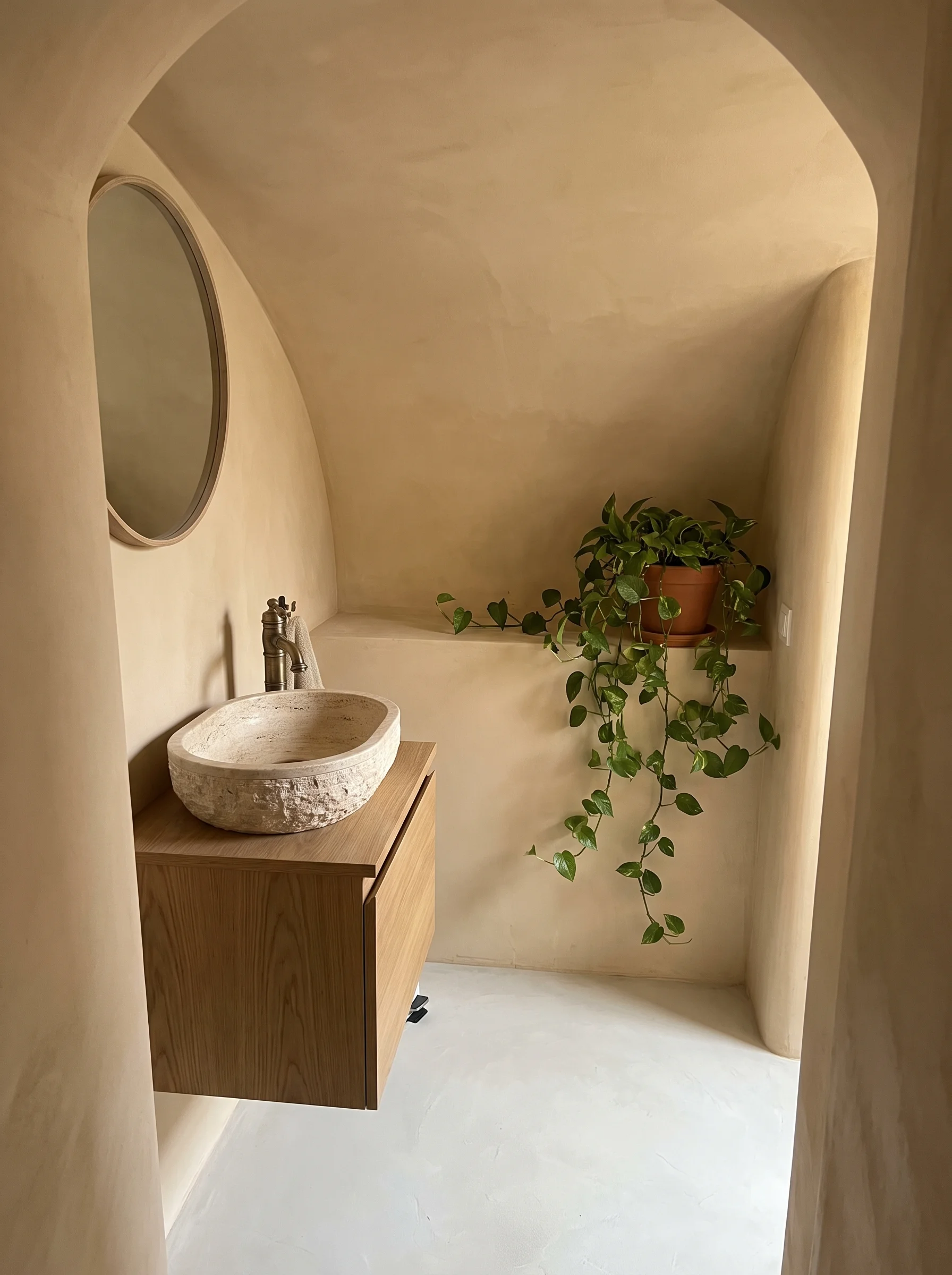 Curved Plaster Cocoon with a Round Mirror