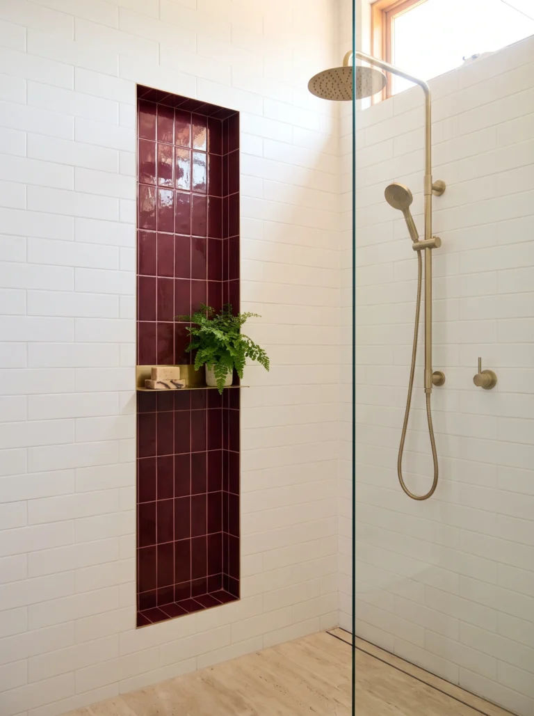 burgundy tile niche inside a white subway shower