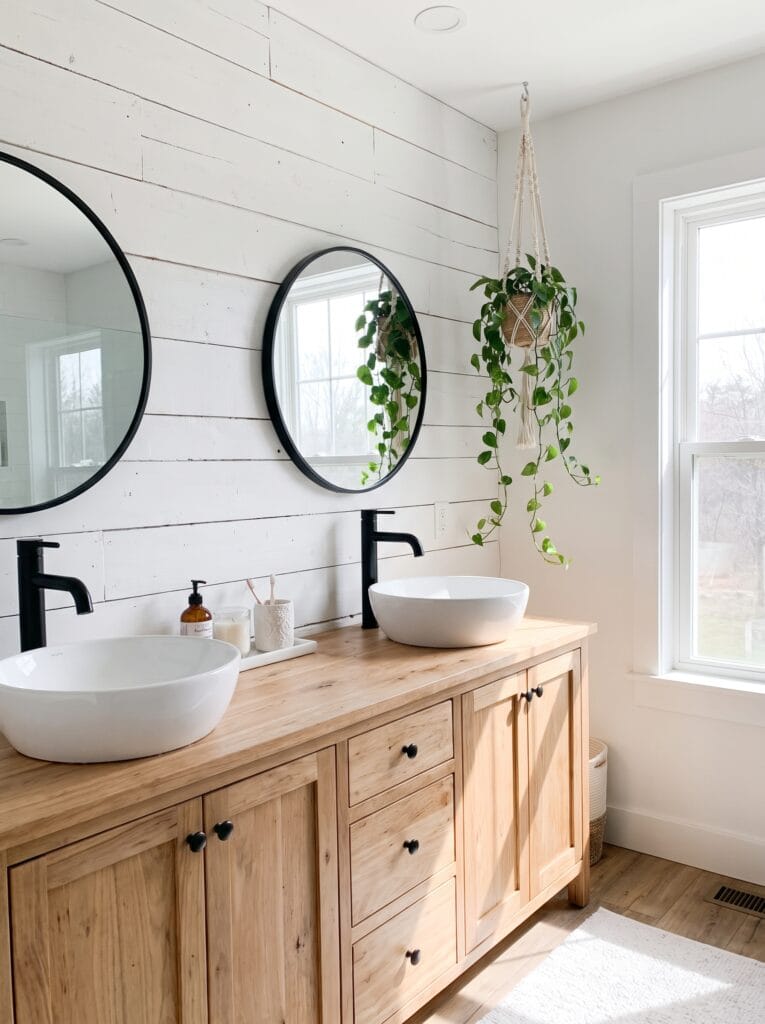 whitewashed shiplap wall behind a double vanity